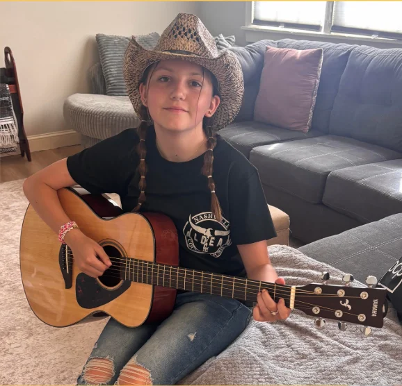 Emma playing guitar