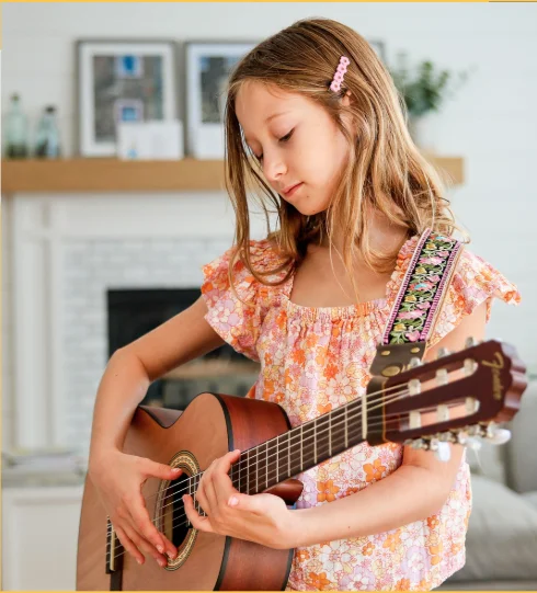 Lila playing guitar